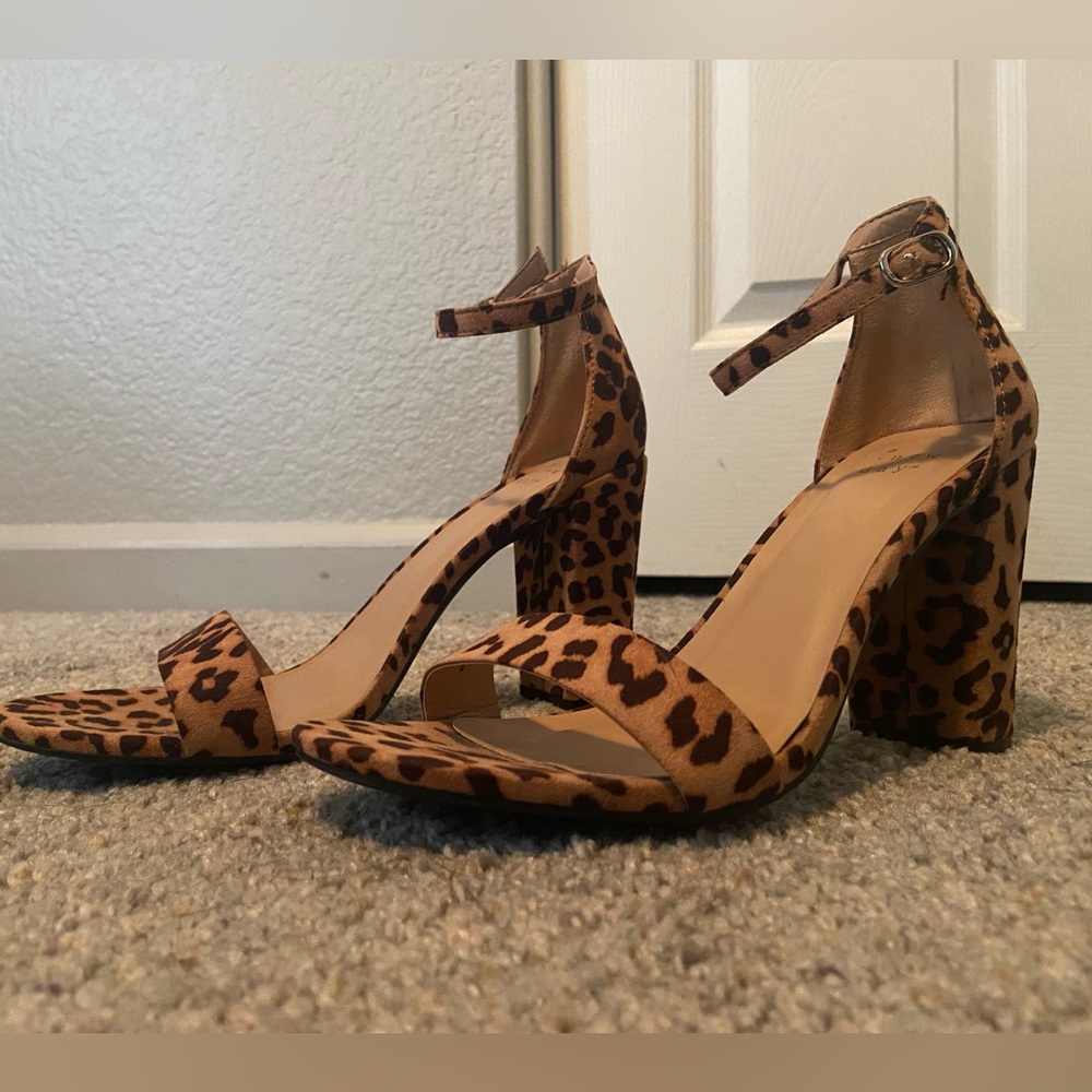 A New Day opened toe leopard print pumps. Size 8.5, never worn.